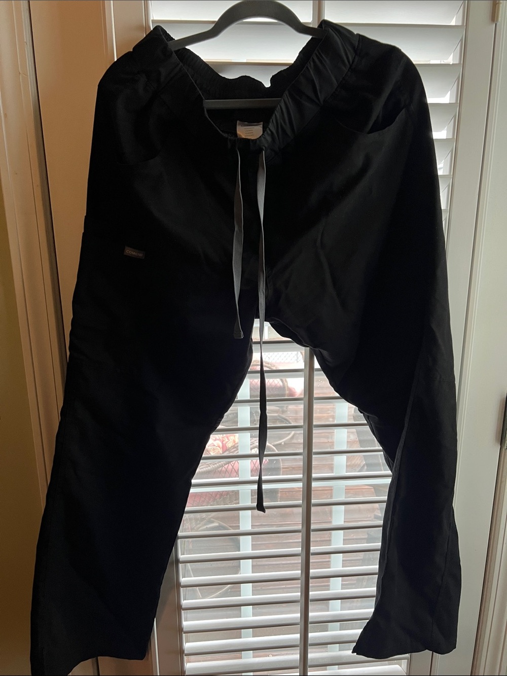 Women’s Comenii black scrub pants.